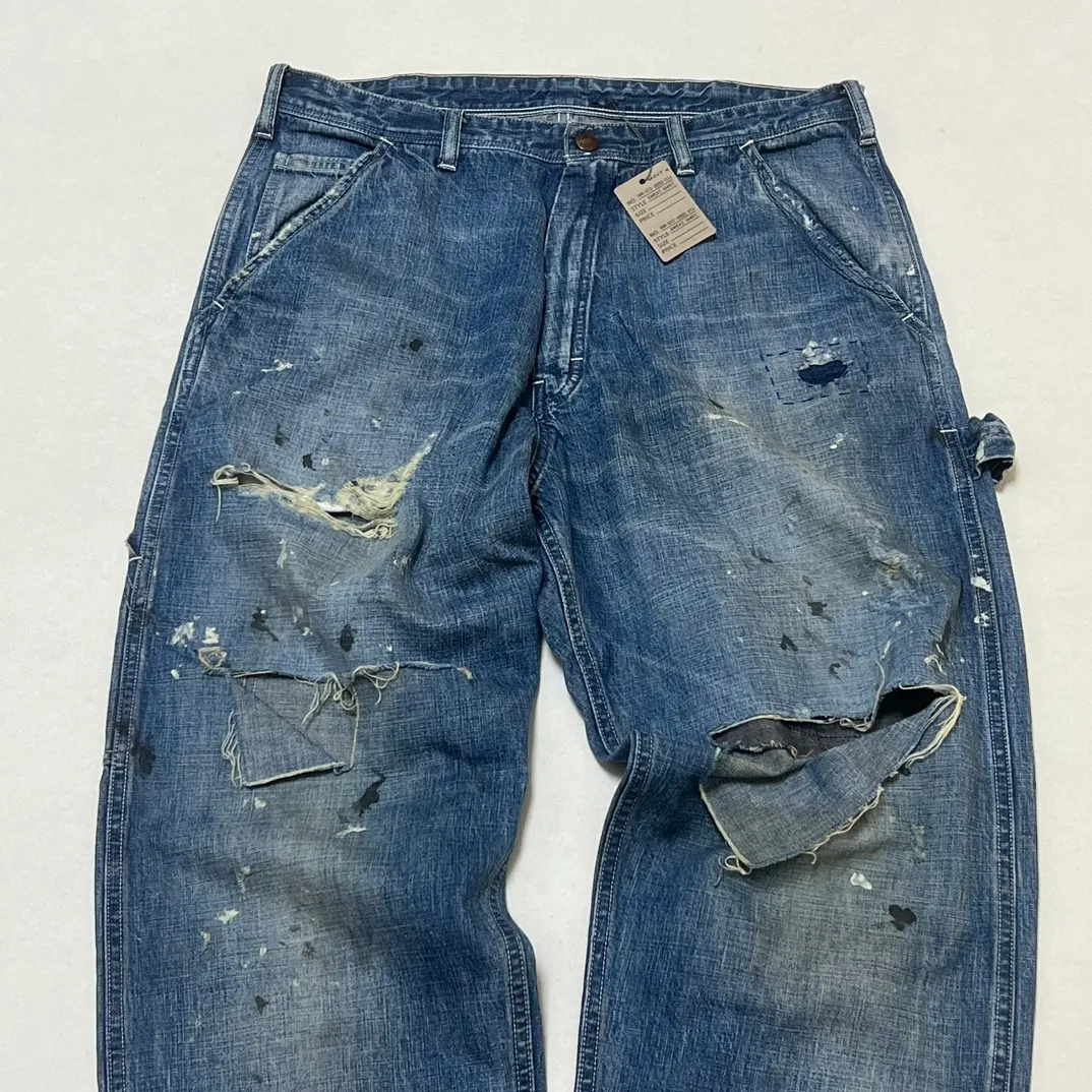 SAINT Mxxxxxx SAINT_DENIM PANTS/PAINTER /BLUE Logging trousers with knife-cut holes and splashed ink. Patch jeans. Blue S-XL. All accessories are molded and customized. Super heavy work. Washed and distressed. Knife-cut holes. Artificial splashed ink graffiti. Authentic version. Loose and stylish.